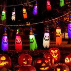 Halloween Witch Hat Lanterns glowing above pumpkins in a colorful outdoor Halloween party scene