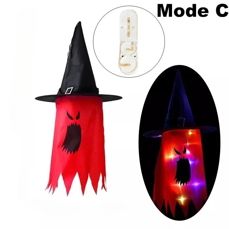 Halloween Witch Hat Lanterns in red, shown unlit and glowing with a spooky character face