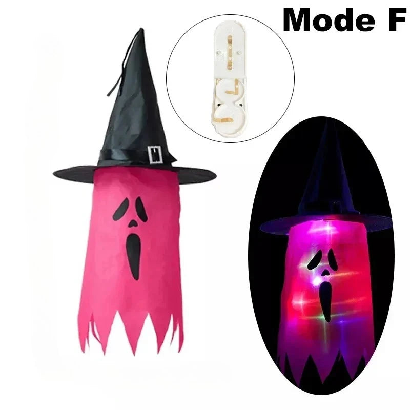Halloween Witch Hat Lanterns in rose red, shown unlit and glowing with a ghost-style face