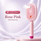 Heatless Straightening Brush in pink shown upright with fine mist spraying from the brush head