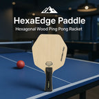 HexaEdge™ - Ping Pong Paddle hexagonal wood design on blue table with black handle by HighPeak in a modern indoor setting