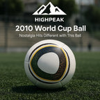 HighPeak 2010 World Cup Inspired Ball on green turf showing seamless PU design and classic multicolor panel pattern