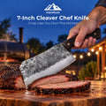 7-Inch Cleaver Chef Knife slicing smoked brisket on a wooden board at a backyard barbecue.