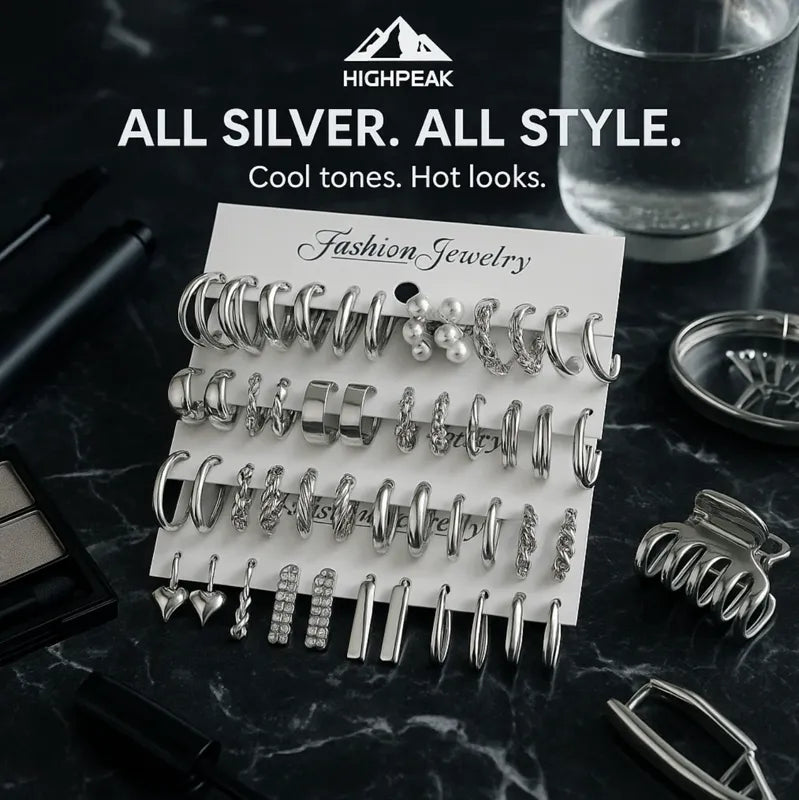 HighPeak 48-Piece Earring Set featuring all silver hoops, studs, and drops displayed on black marble with makeup accessories nearby