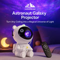 HighPeak Astronaut Galaxy Projector in white displays colorful nebula lights on ceiling with remote in cozy bedroom setting