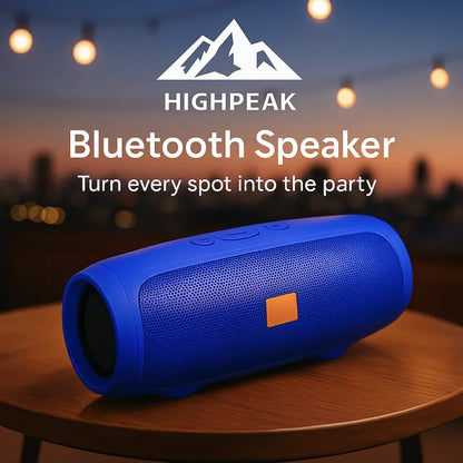 HighPeak Bluetooth Speaker in blue on a wooden table with city lights, portable and ready for outdoor party use