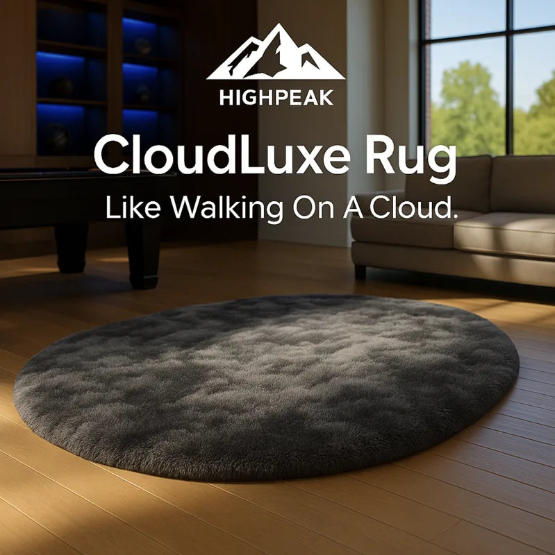 HighPeak CloudLuxe™ - Ultra Soft Rug in dark gray oval shape on wood floor in modern living room setting