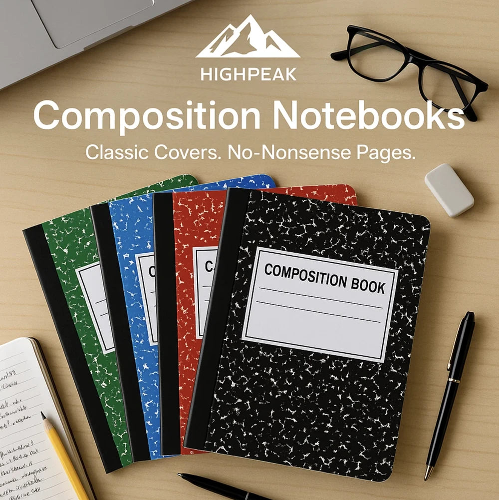 HighPeak Composition Notebooks 4-pack in black, red, blue, and green with classic covers on a wooden desk.