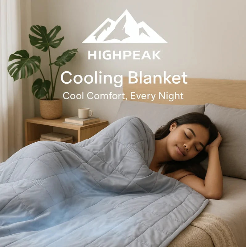 HighPeak Cooling Blanket in light gray with a woman sleeping peacefully in a modern bedroom setting