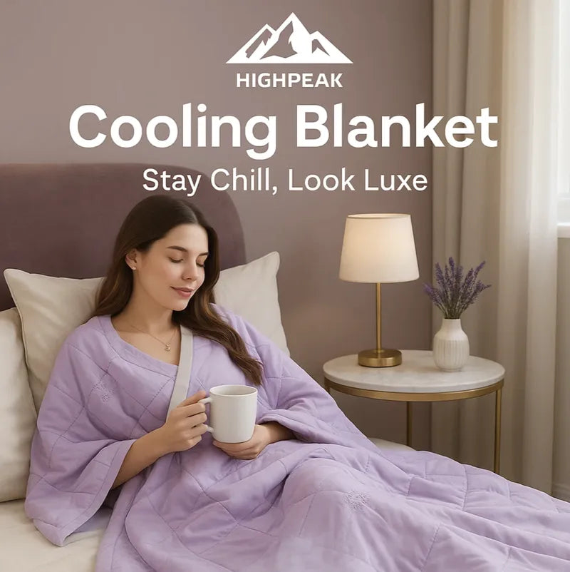HighPeak Cooling Blanket in soft lavender on bed with woman relaxing and holding a mug in cozy bedroom setting