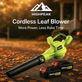 HighPeak Cordless Leaf Blower in green with two 21V batteries on a leaf-covered driveway at sunset
