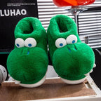 Green crocodile slipper pair showing plush collars, raised eyes and rounded toes