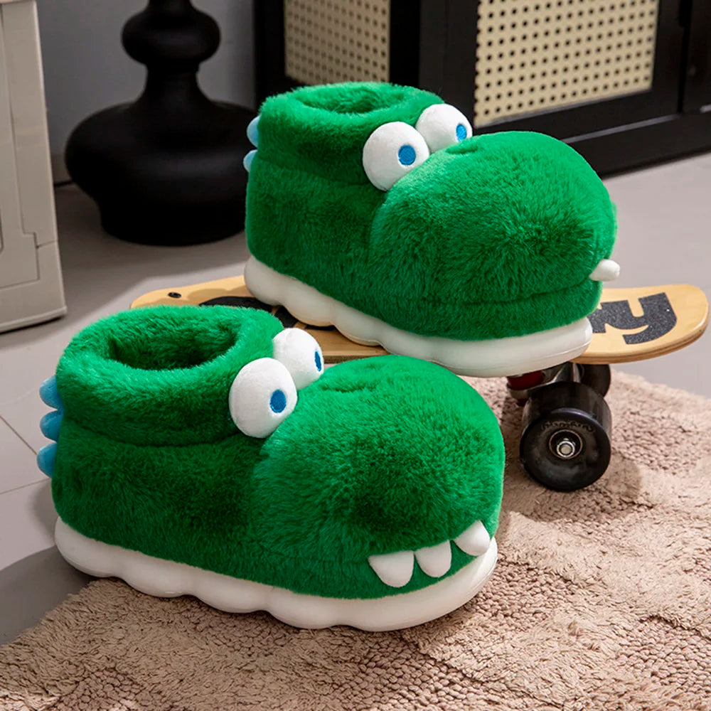Green crocodile slippers displayed on a beige rug and wooden skateboard