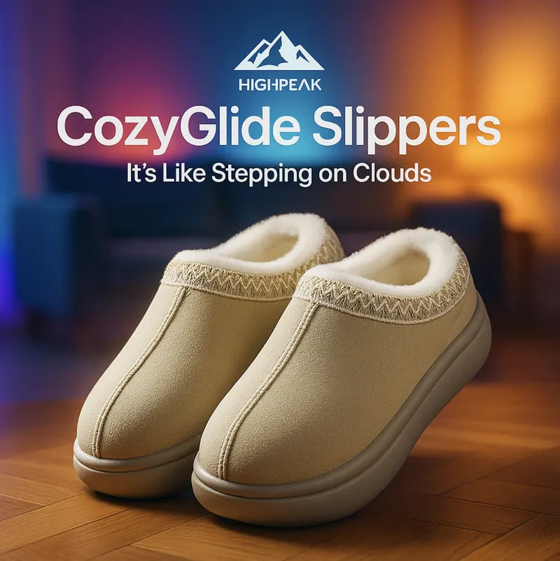 HighPeak CozyGlide Slippers in beige with plush fleece lining and durable sole on wooden floor in warm indoor setting