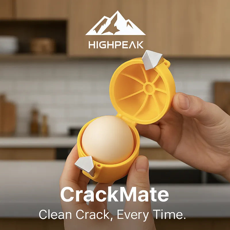 HighPeak CrackMate™ eggshell separator in yellow held open with a whole egg inside in a kitchen setting