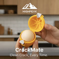 HighPeak CrackMate™ eggshell separator in yellow held open with a whole egg inside in a kitchen setting