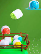 Sheep shown flying toward a green pen with a blue sheep on a launcher