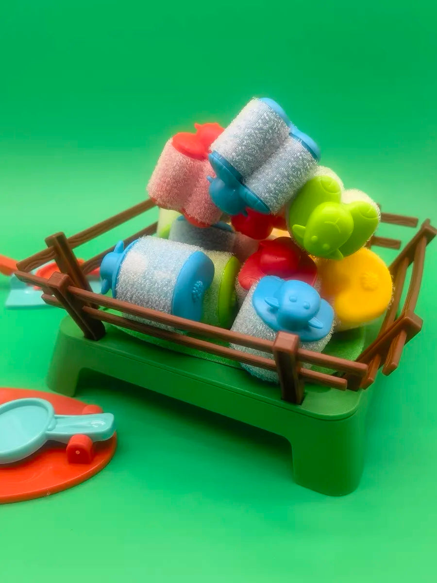 Colorful hook-and-loop sheep piled inside the green pen