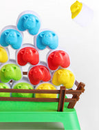 Close-up of colorful sheep stacked behind the game pen fence