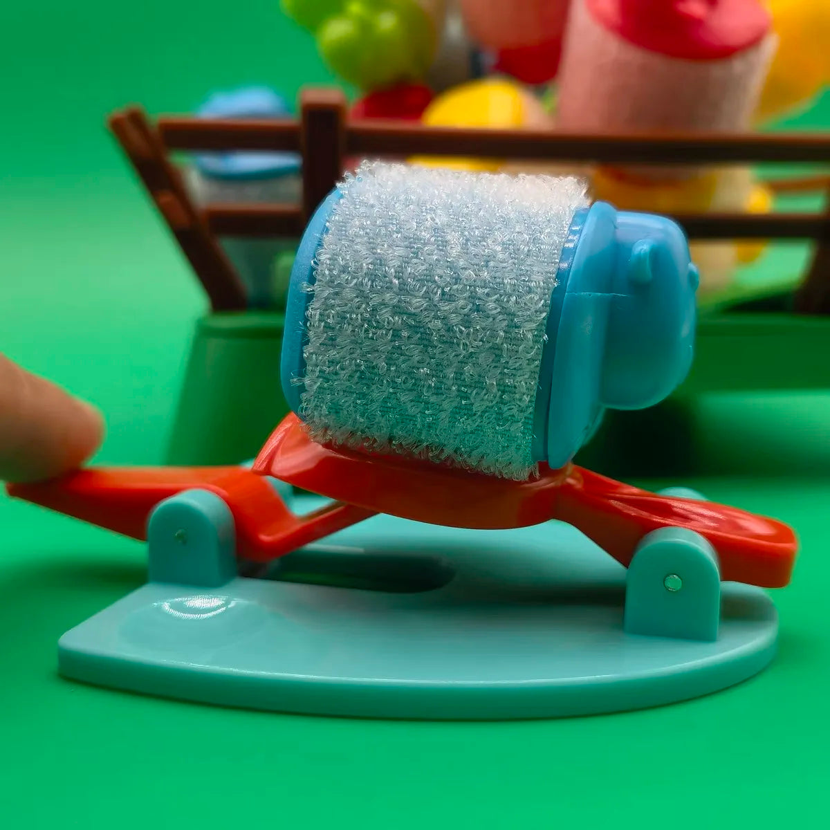 Close-up of a blue sheep on a red springboard with a pale blue base