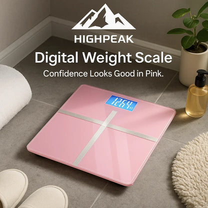 HighPeak Digital Weight Scale in pink with blue LCD on bathroom floor near towel and plant, sleek and accurate design.