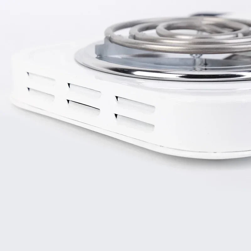 Close-up of side ventilation openings beneath the dual burner electric cooktop's heating coil