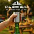 HighPeak Easy Push Bottle Opener in stainless steel removing a bottle cap outdoors at a backyard gathering