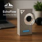 HighPeak EchoFlow speaker with wood grain finish and ferrofluid display on a desk in modern setup