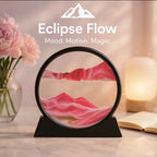 Eclipse Flow™ Dynamic Sand Art in pink tones on black base beside flowers and lamp on a calm desk by HighPeak