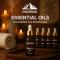 HighPeak Essential Oils lavender bottle with dropper on wooden tray in warm spa setting for stress relief.