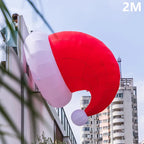 6.6FT (2M) Giant Inflatable Santa Hat mounted beside a building