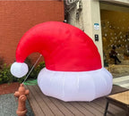 Giant Inflatable Santa Hat displayed on an outdoor deck
