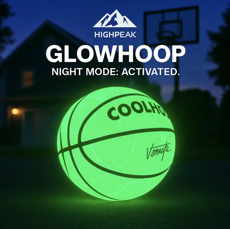 HighPeak GlowHoop™ Light-Up Basketball glowing green at night outdoors near a basketball hoop.
