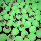 Close-up of many green Glowing Eyeball Bouncy Balls with printed irises