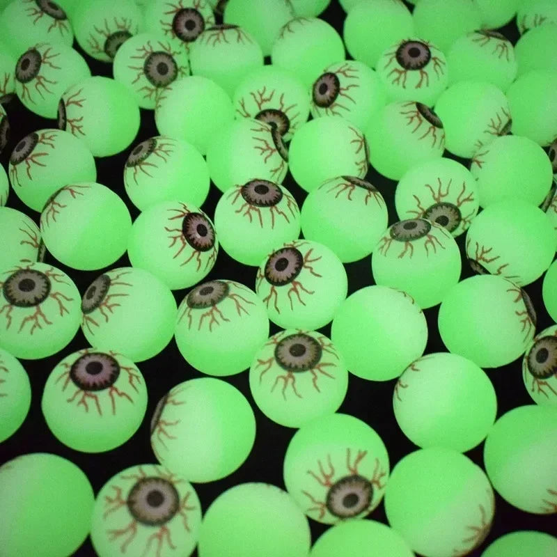 Close-up of many green Glowing Eyeball Bouncy Balls with printed irises