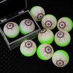 Glowing Eyeball Bouncy Balls arranged inside and beside an open decorative treasure box