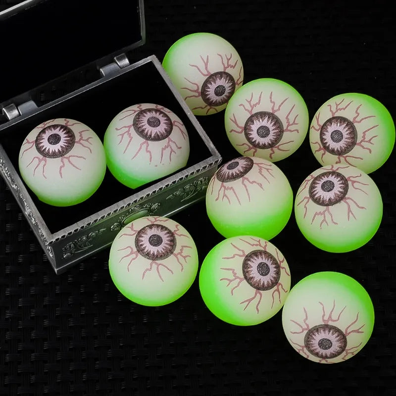 Glowing Eyeball Bouncy Balls arranged inside and beside an open decorative treasure box