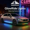 HighPeak GlowEdge™ LED Car Door Lights glowing blue and rainbow under a silver sedan at night outside a neon-lit club.