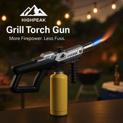 HighPeak Grill Torch Gun with yellow propane tank attached, ignited flame, ideal for BBQ and outdoor use at night