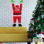 Hanging Santa Claus Decor on a white brick wall above a yellow sofa beside a Christmas tree.