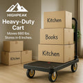 HighPeak Heavy-Duty Folding Cart in black with yellow wheels carrying labeled boxes in a modern home setting