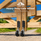 Two black heavy-duty gate wheels with silver metal hardware mounted on wooden gate posts outdoors on a gravel path, with the text 'HIGHPEAK Heavy Duty Gate Wheel Built For Heavy Gates' overlaid at the top.