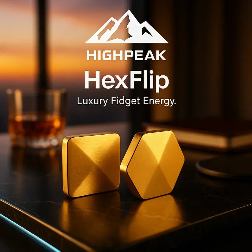 HighPeak HexFlip luxury gold metal fidget toy on dark desk with sunset background for focused energy and stress relief
