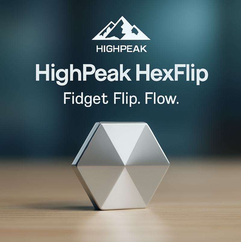 HighPeak HexFlip silver metal fidget toy on wood surface with blurred blue background for stress relief and focus