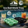 HighPeak Ice Ball Mold Tray in green and black silicone with large ice spheres by a poolside setup