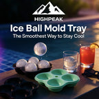 HighPeak Ice Ball Mold Tray in green silicone with large ice spheres by the poolside next to drinks and sunglasses