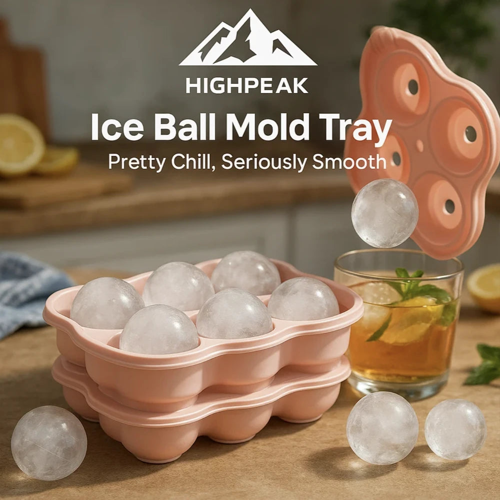 HighPeak Ice Ball Mold Tray in peach silicone with large ice spheres and whiskey glass for slow-melting drinks.