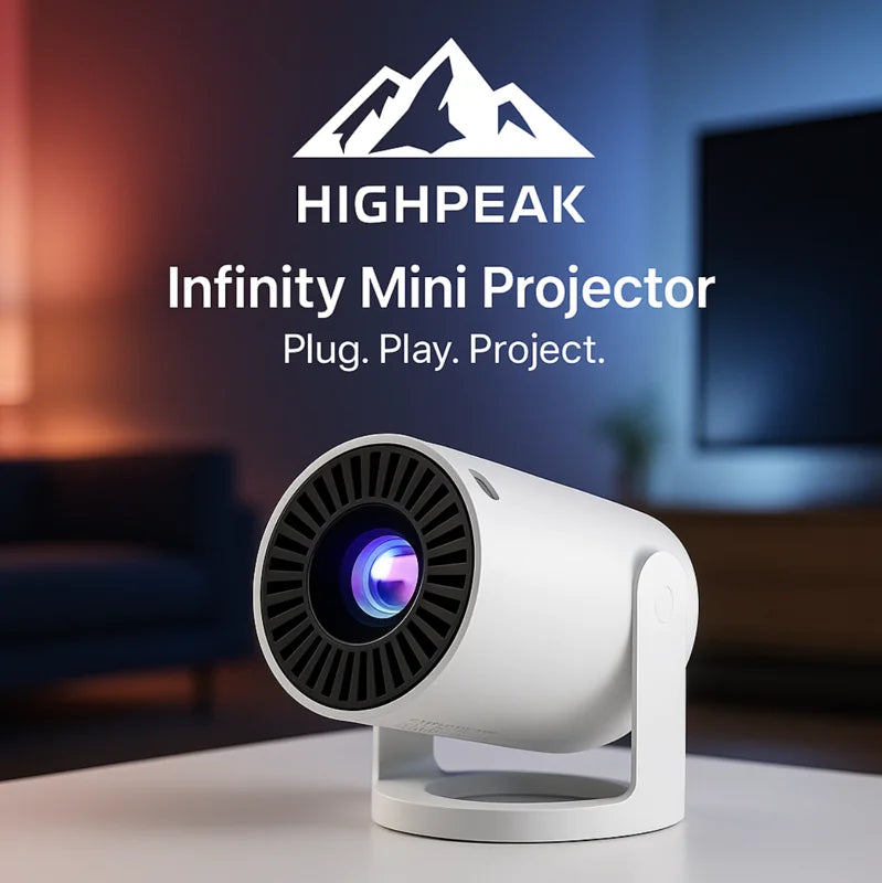 HighPeak VisionHack Projector Bundle with white Infinity Mini Projector on table in cozy, dimly lit living room setting