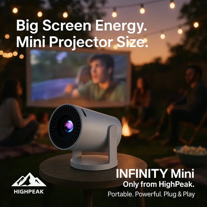 HighPeak INFINITY MiniProjector 2025 in white on a table projecting outdoors at dusk for backyard movie night.