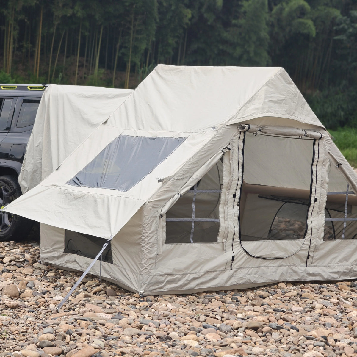 Inflatable Car Camping Tent close-up showing its mesh doorway, clear side panel and window cover